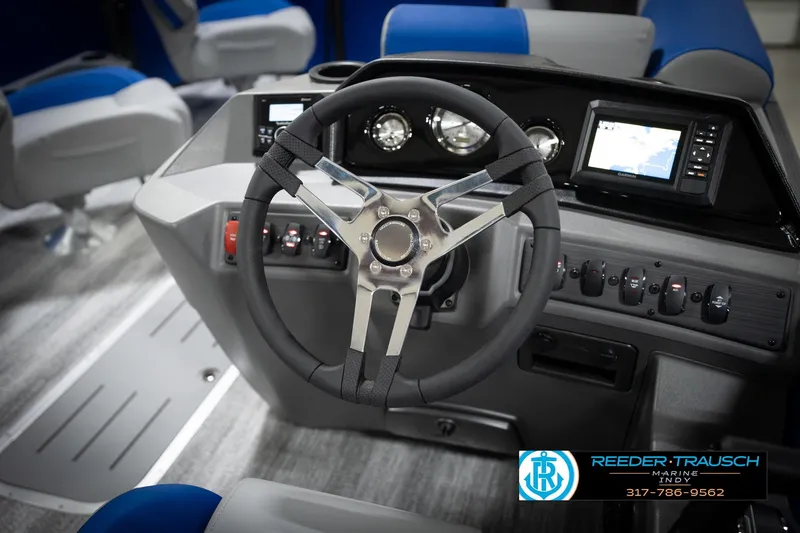Slide: The Image of Close-up of 2026 Bennington 22 SSB steering wheel with logo and metallic finish. - 34