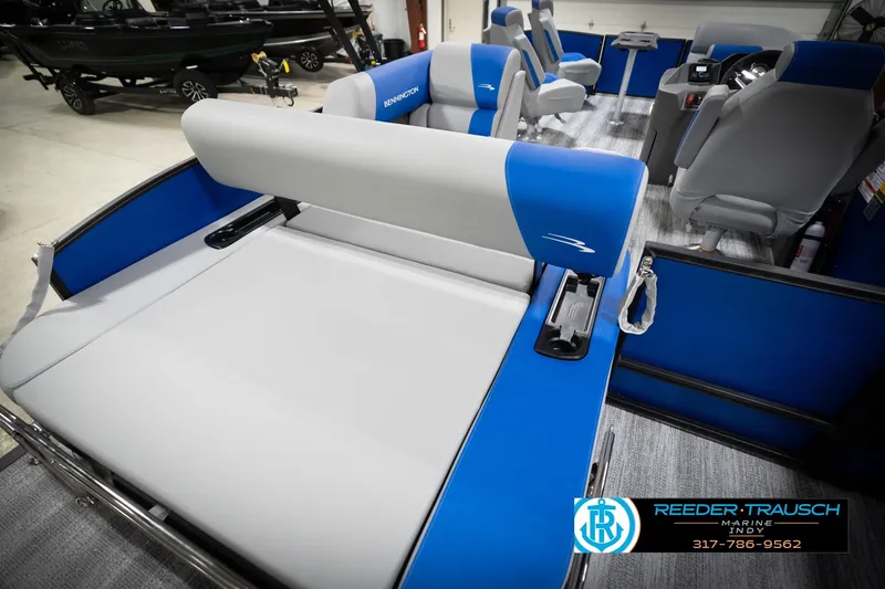 Slide: The Image of 2026 Bennington 22 SSB boat interior with blue and gray seating at Reeder-Trausch Marine. - 46