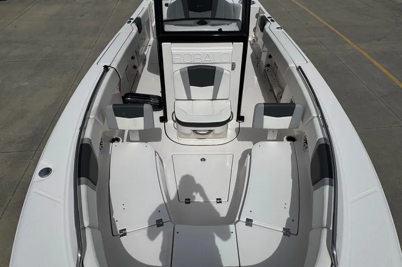 Slide: The Image of 2023 Robalo R250 Center Console boat interior with seating and storage compartments. - 11