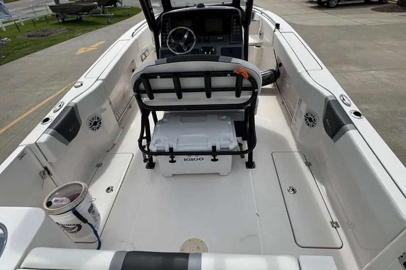Slide: The Image of 2023 Robalo R250 Center Console boat interior with seating and storage. - 21