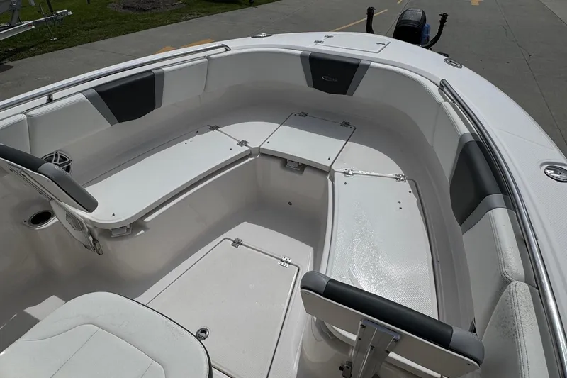 Slide: The Image of 2023 Robalo R250 Center Console boat interior with seating and storage compartments. - 8
