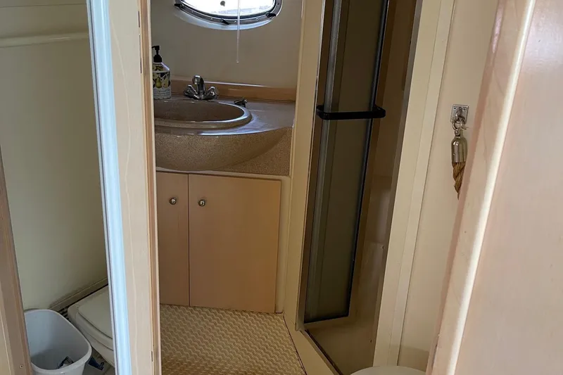 Slide: The Image of Bathroom interior of 1999 Carver Mariner 350 yacht with sink and shower. - 15