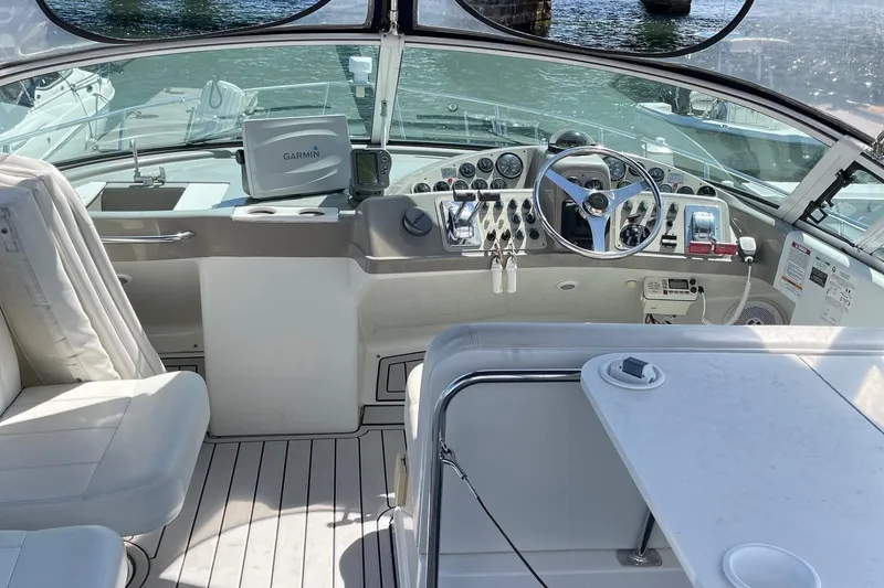 Slide: The Image of 1999 Carver Mariner 350 yacht cockpit with steering wheel and navigation equipment. - 3