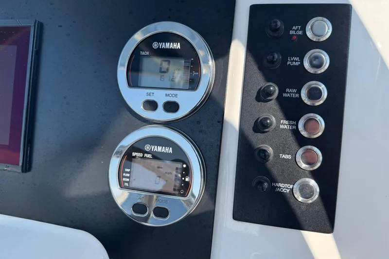 Slide: The Image of Control panel of 2023 Robalo R222 Explorer with Yamaha gauges and switches. - 16