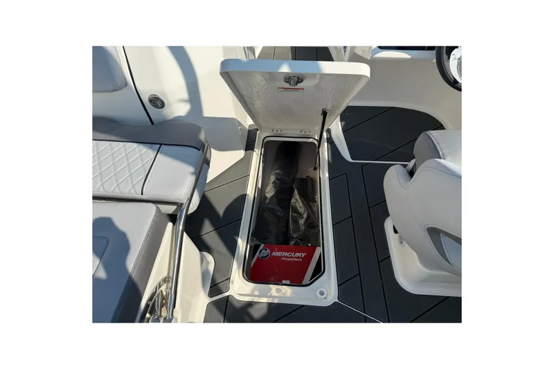 Slide: The Image of 2025 Bayliner D22I boat storage compartment with Mercury propeller box. - 12