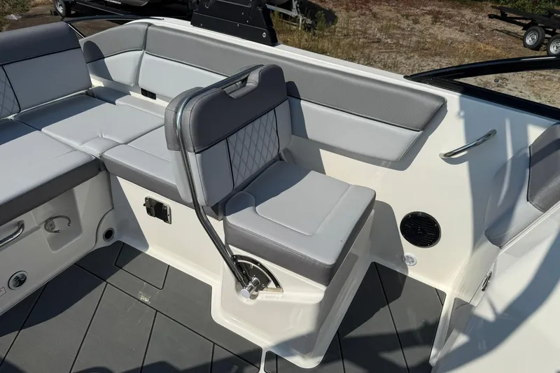 Slide: The Image of 2025 Bayliner D22I boat interior with gray cushioned seating and modern design. - 5