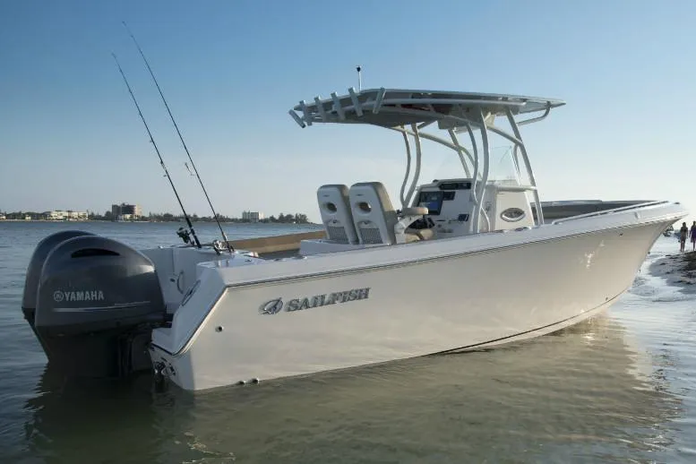 Slide: The Image of Manufacturer Provided Image: 2019 Sailfish 270 CC boat docked in shallow water with Yamaha outboard motor. - 33