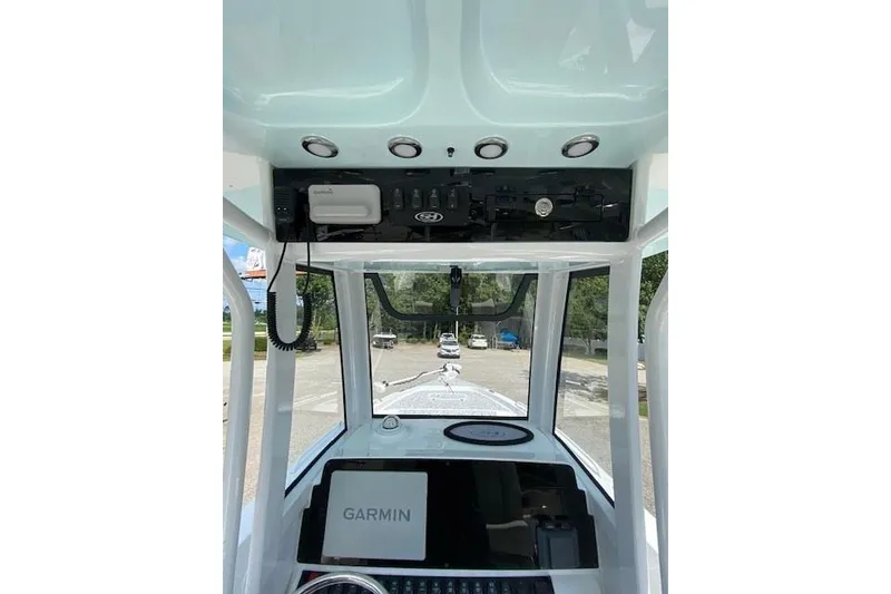 Slide: The Image of 2024 Sea Hunt BX 25 FS boat dashboard with Garmin navigation system. - 11