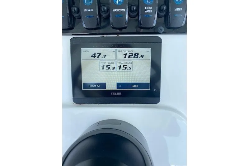 Slide: The Image of 2024 Sea Hunt BX 25 FS dashboard with Yamaha display showing trip data and controls. - 13