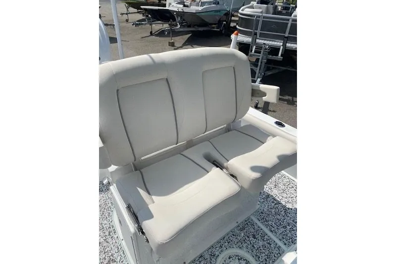 Slide: The Image of 2024 Sea Hunt BX 25 FS boat seating, featuring comfortable beige cushions. - 17