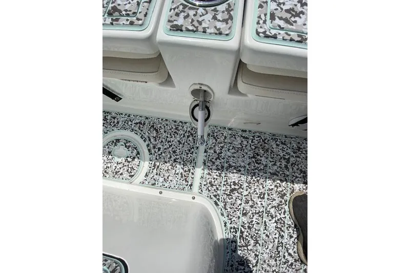 Slide: The Image of 2024 Sea Hunt BX 25 FS boat interior with patterned flooring and storage compartments. - 19