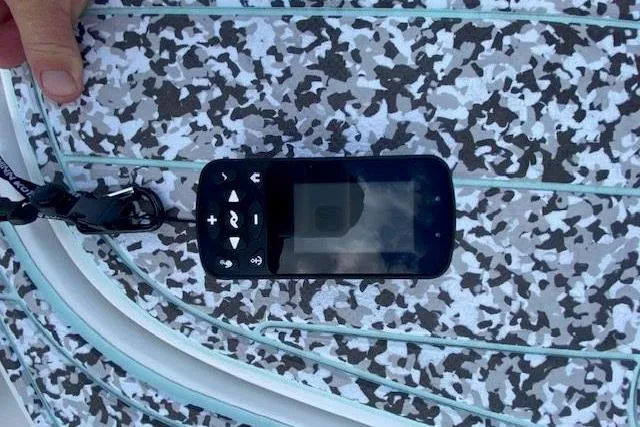 Slide: The Image of 2024 Sea Hunt BX 25 FS boat deck with electronic device on patterned surface. - 28