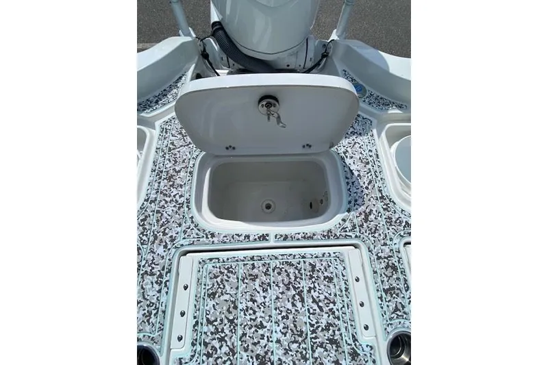 Slide: The Image of 2024 Sea Hunt BX 25 FS boat deck with open storage compartment. - 9