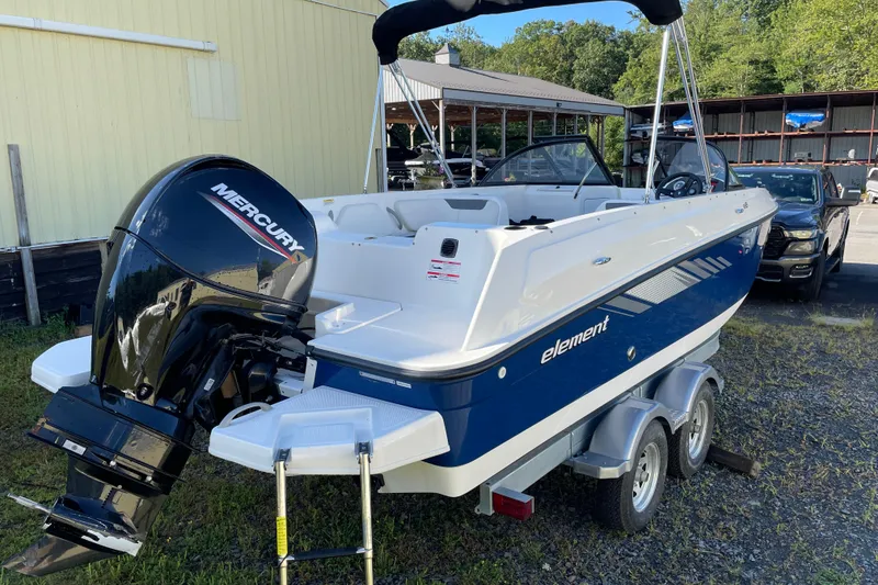 Slide: The Image of 2024 Bayliner Element E21 boat with Mercury outboard motor on trailer. - 5
