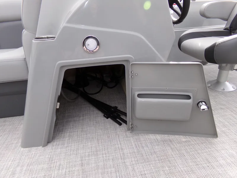 Slide: The Image of 2023 Trifecta 20C CS boat storage compartment with open door, revealing interior space. - 13