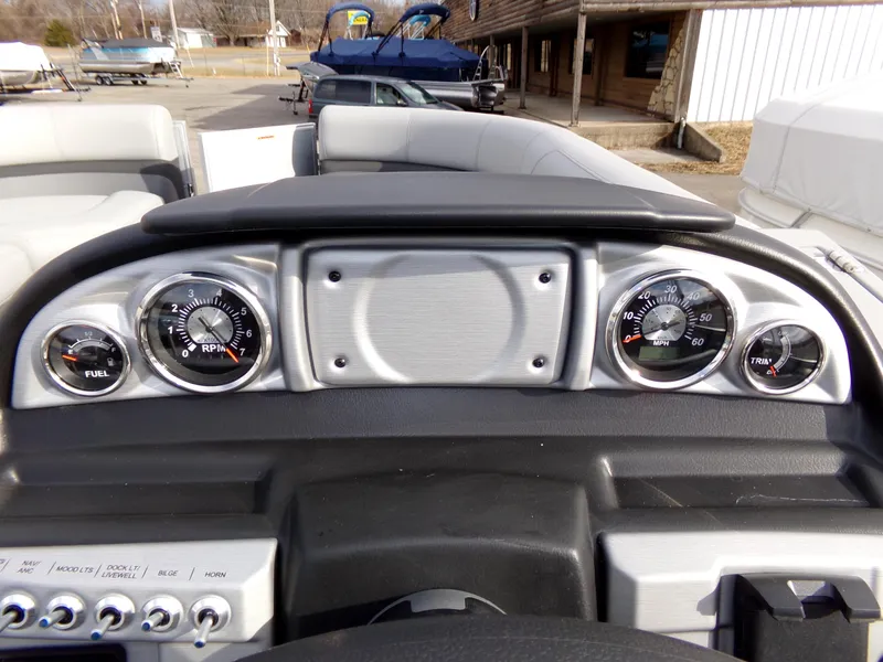 Slide: The Image of Dashboard of 2023 Trifecta 20C CS boat with gauges and controls. - 16