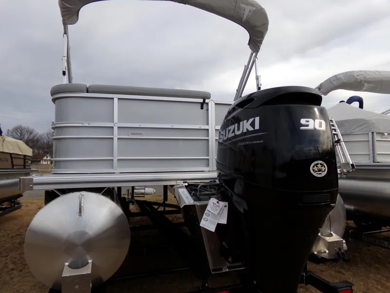 Slide: The Image of 2023 Trifecta 20C CS pontoon boat with Suzuki 90 horsepower engine. - 2