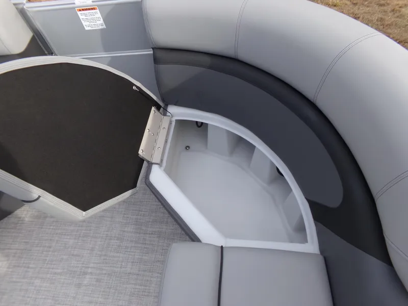 Slide: The Image of 2023 Trifecta 20C CS boat interior with gray seating and storage compartment. - 8