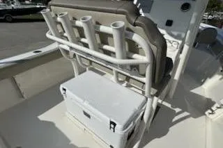 Slide: The Image of 2024 Key West 219 FS boat with rod holders and cooler on deck. - 11