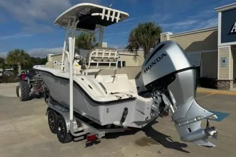 Slide: The Image of 2024 Key West 219 FS boat with Honda outboard motor on a trailer. - 2
