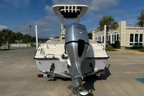 Slide: The Image of 2024 Key West 219 FS boat with 200 HP engine, parked outdoors. - 3