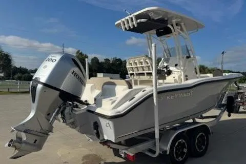 Slide: The Image of 2024 Key West 219 FS boat with Honda outboard motor on a trailer. - 4