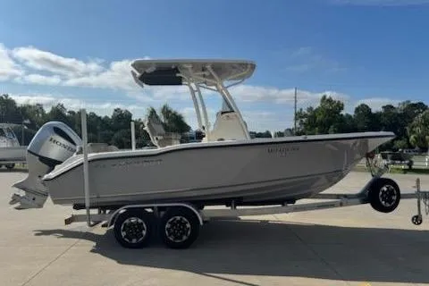 Slide: The Image of 2024 Key West 219 FS boat on trailer, side view, outdoors under clear sky. - 5