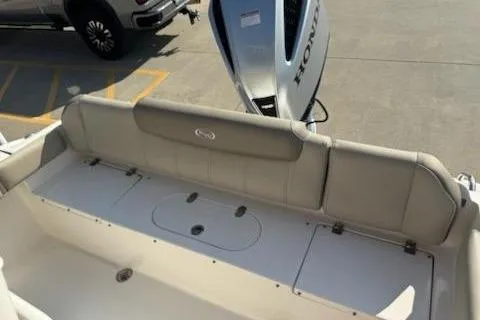 Slide: The Image of 2024 Key West 219 FS boat with Honda outboard motor, rear seating view. - 8