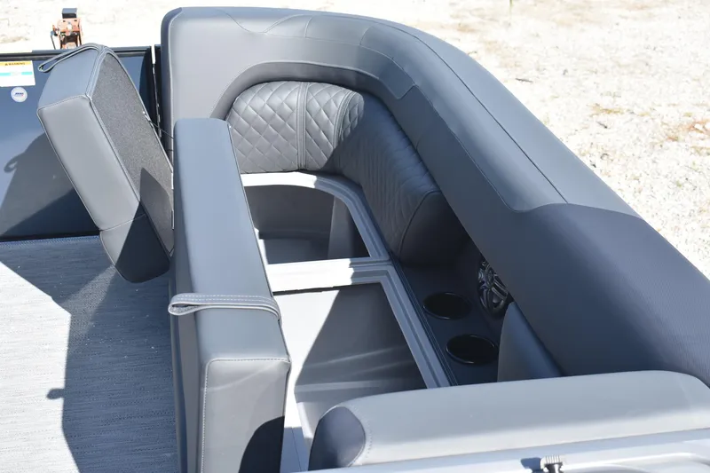 Slide: The Image of 2026 Godfrey SWEETWATER SW 2086 C boat interior with gray seating and cup holders. - 17