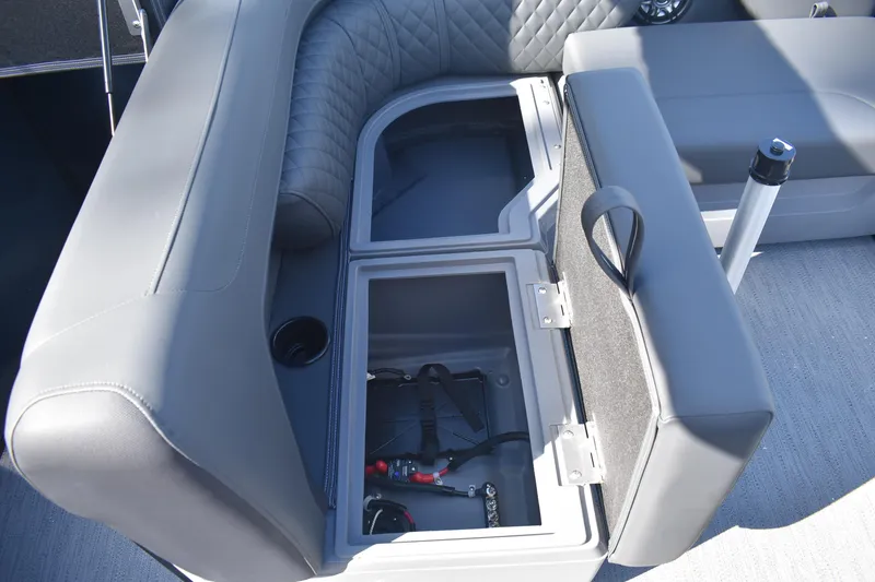 Slide: The Image of 2026 Godfrey SWEETWATER SW 2086 C boat seat storage compartment with open lid. - 20