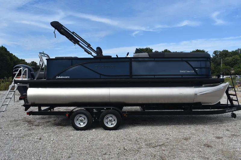 Slide: The Image of 2026 Godfrey Sweetwater 2086C Tritoon on trailer, parked outdoors under blue sky. - 4