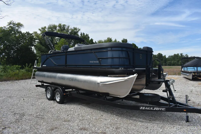 Slide: The Image of 2026 Godfrey Sweetwater 2086C Tritoon on trailer, parked outdoors on gravel. - 5