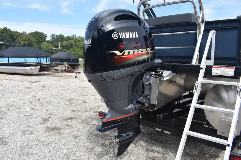 Slide: The Image of 2026 Godfrey Sweetwater 2086C Tritoon with Yamaha Vmax outboard motor in a boatyard. - 8