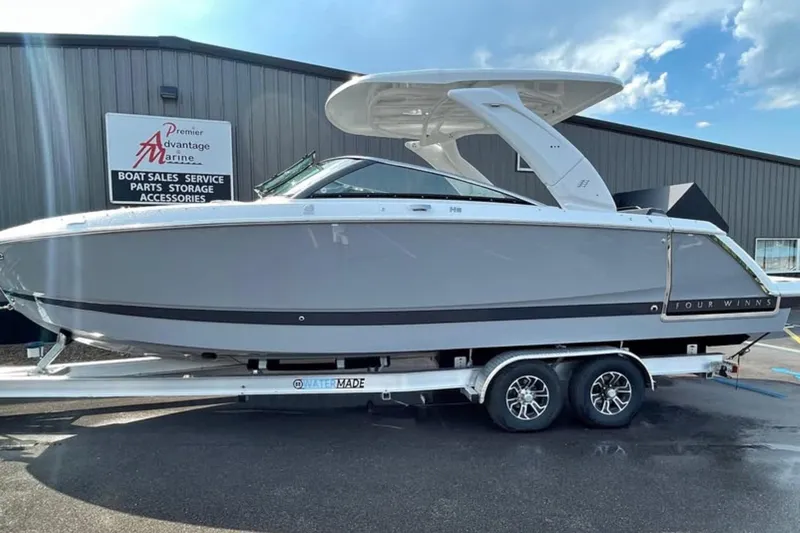 The Image of 2026 Four Winns H9 boat on trailer at Premier Advantage Marine dealership. - 0