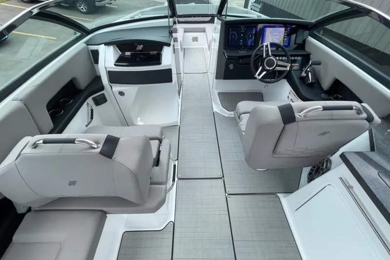 Slide: The Image of Luxurious interior of 2026 Four Winns H9 boat with modern dashboard and seating. - 10