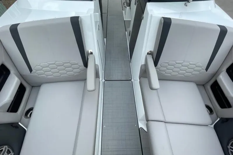 Slide: The Image of 2026 Four Winns H9 boat interior with gray seating and modern design. - 13