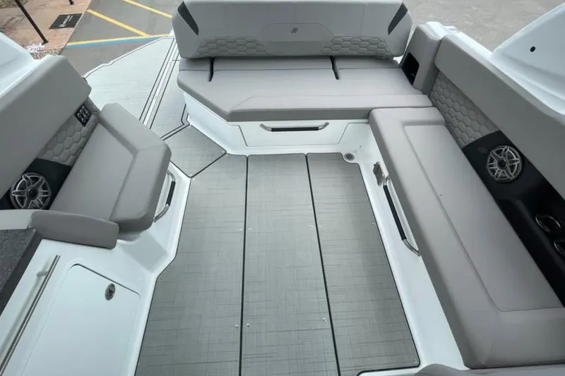 Slide: The Image of 2026 Four Winns H9 boat interior with gray seating and modern design. - 14