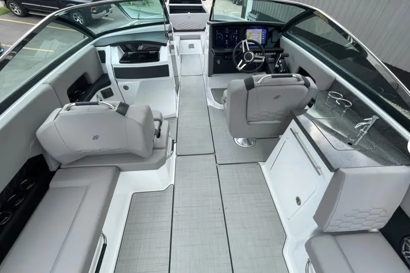 Slide: The Image of Luxurious interior of 2026 Four Winns H9 boat with modern seating and sleek dashboard. - 3