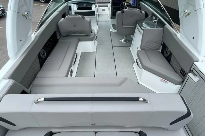 Slide: The Image of 2026 Four Winns H9 boat interior with sleek seating and modern design. - 5