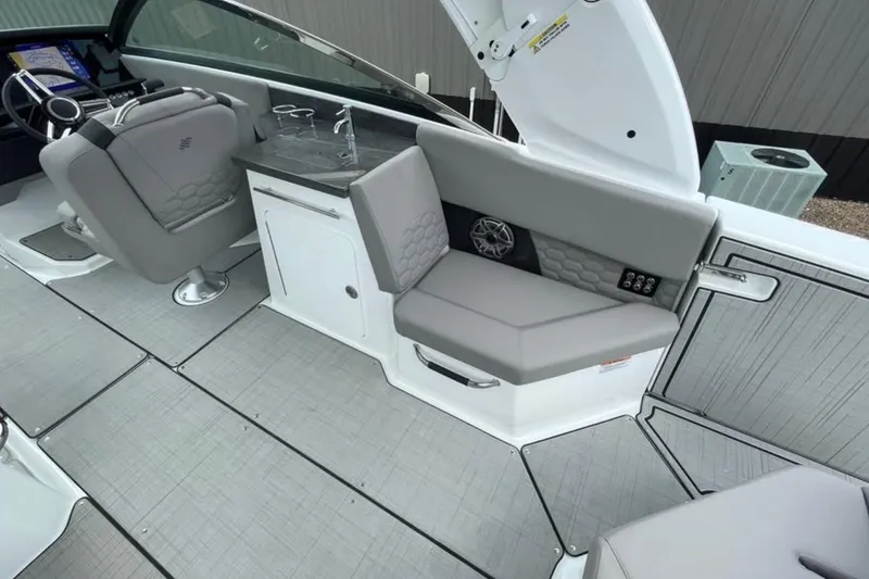 Slide: The Image of Interior of 2026 Four Winns H9 boat with modern seating and sleek design. - 6
