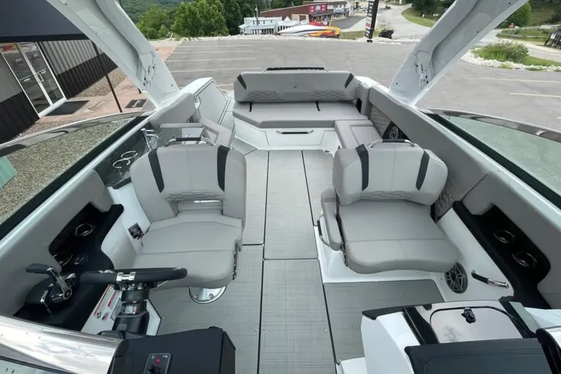 Slide: The Image of 2026 Four Winns H9 boat interior with modern seating and sleek design. - 7