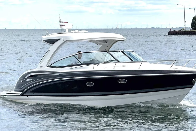 Slide: The Image of 2018 Formula 350 Sun Sport boat cruising on open water. - 1