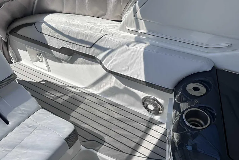 Slide: The Image of 2018 Formula 350 Sun Sport boat interior with white seating and cup holders. - 11