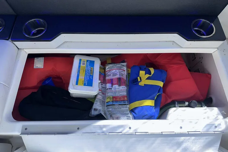 Slide: The Image of Storage compartment in a 2018 Formula 350 Sun Sport with safety gear and life jackets. - 14