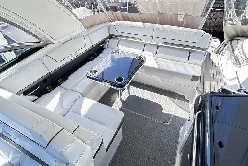 Slide: The Image of Luxurious interior of 2018 Formula 350 Sun Sport boat with sleek seating and table. - 15