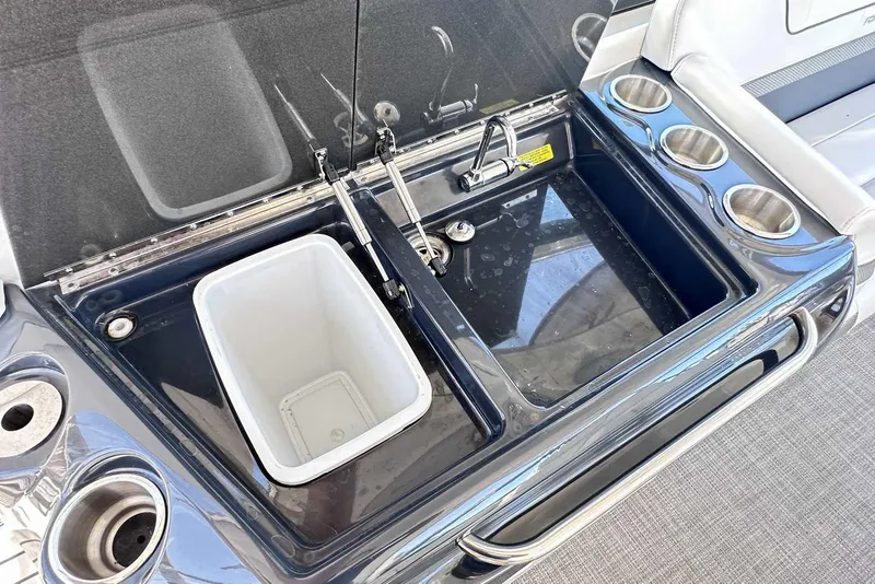 Slide: The Image of 2018 Formula 350 Sun Sport boat sink and cup holders in cockpit area. - 17