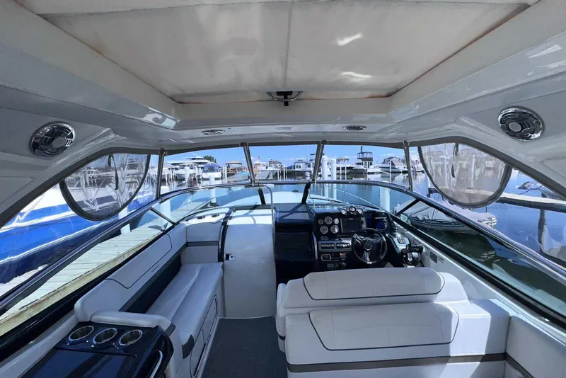 Slide: The Image of Interior view of a 2018 Formula 350 Sun Sport boat at a marina. - 22