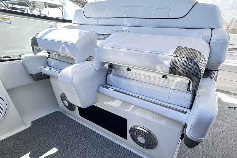 Slide: The Image of 2018 Formula 350 Sun Sport boat interior seating with modern design and speaker system. - 24