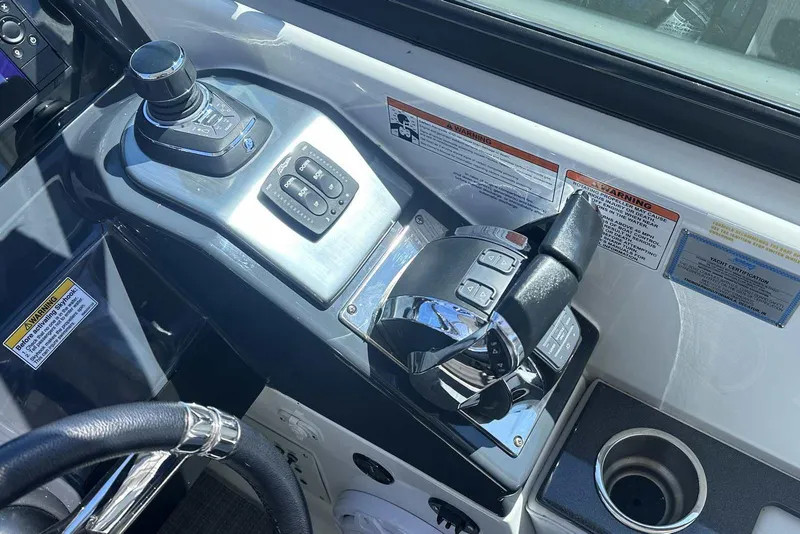 Slide: The Image of Control panel of a 2018 Formula 350 Sun Sport boat with steering wheel and throttle. - 29