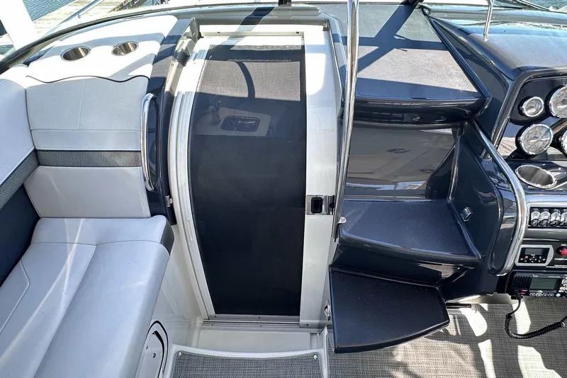 Slide: The Image of 2018 Formula 350 Sun Sport boat interior with seating and control panel. - 31